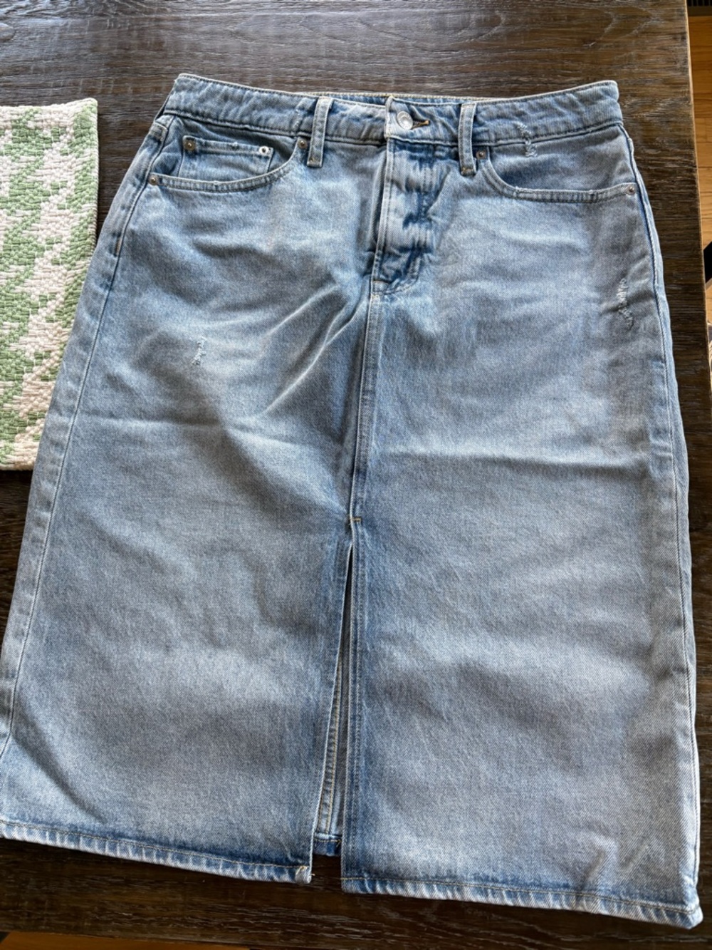 Light Blue Denim Midi Skirt - Classic Straight Fit with distressed details.